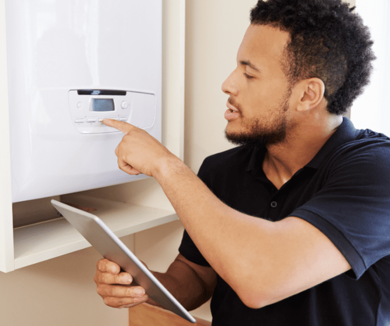 Heating engineer fixing a boiler